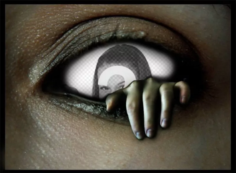 Fotomontaje dentro de un ojo siniestro, con una mano saliendo siniestramente de él. ..